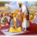 Guru_Angad_Dev_Ji_blessing_Guru_Amar_Das_Ji_with_Siropa.jpg